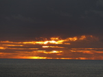 FZ010438 Sunset behind clouds at Worms head, Rhossili.jpg
